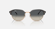 Round sunglasses with black frame, rose-gold outer rim, and gray tinted lenses