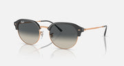 Round sunglasses with black frame, rose-gold accents, and gray tinted lenses