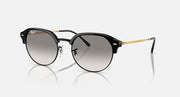Round sunglasses with black frame, grey lenses, and gold metal arms.