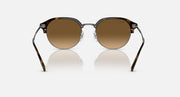 Round sunglasses with dark frame and warm brown lenses, front view.