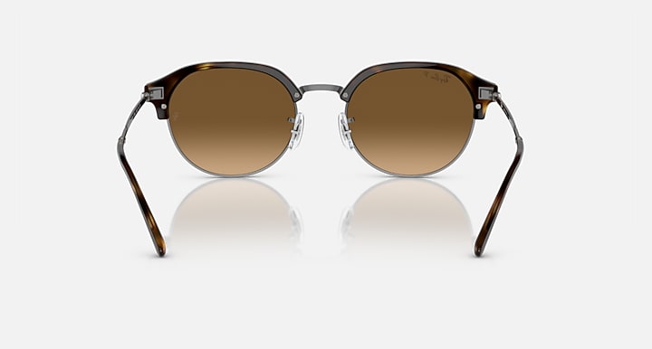 Round sunglasses with dark frame and warm brown lenses, front view.