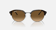 Round sunglasses with dark tortoise-style frame and brown/tan lenses, front view.