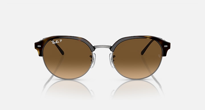 Round sunglasses with dark tortoise-style frame and brown/tan lenses, front view.