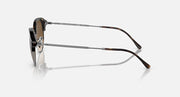 Round sunglasses side profile with black frame and silver metal bridge and arms.