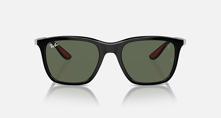 Black sunglasses with dark green lenses and thick cat-eye frame front view