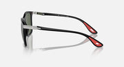 Black sunglasses showing side arms with dark green lenses and metal hinges