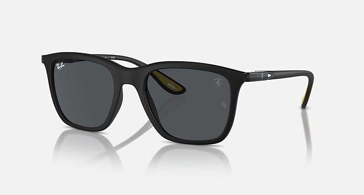 Matte black sunglasses with dark grey lenses and thin metal bridge detail