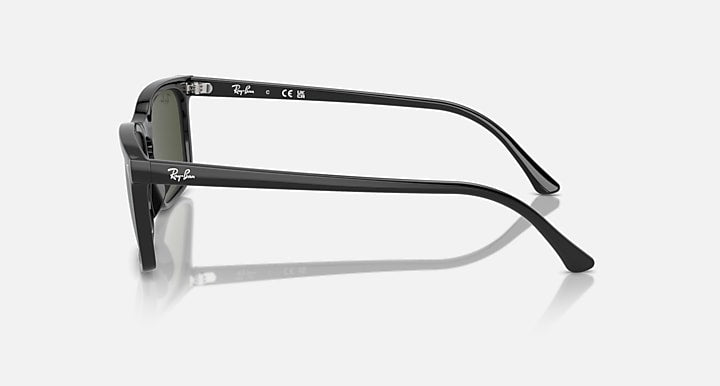 Ray-Ban RB4435 side profile sunglasses with dark green lenses and black frame arms