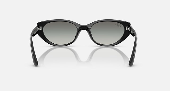 Black cat-eye sunglasses with dark gray lenses and small metal accents at hinges