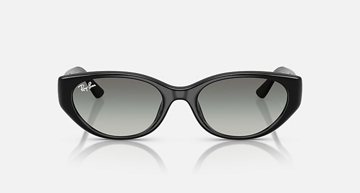 Black cat-eye sunglasses with dark gray lenses, Ray-Ban logo on temples