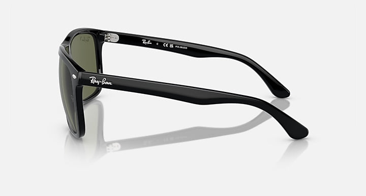 Ray-Ban black sunglasses, side profile with green lenses