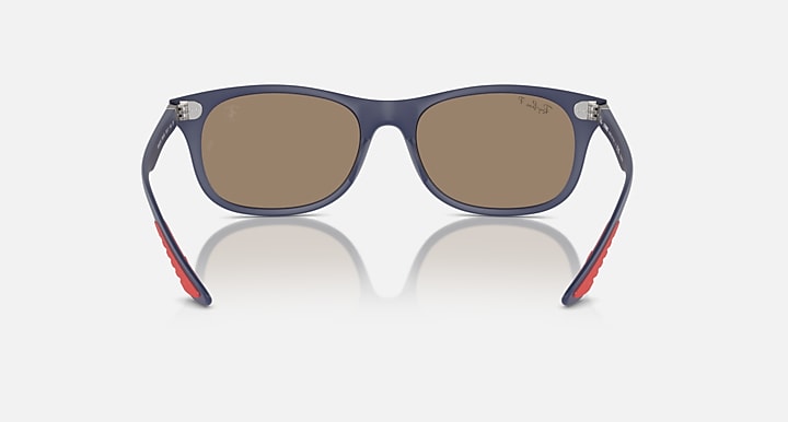Ray-Ban dark navy sunglasses with brown-tinted lenses and red underside temple accents