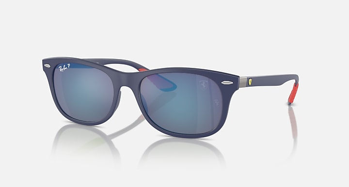 Ray-Ban dark navy sunglasses with mirrored blue lenses and red temple accents