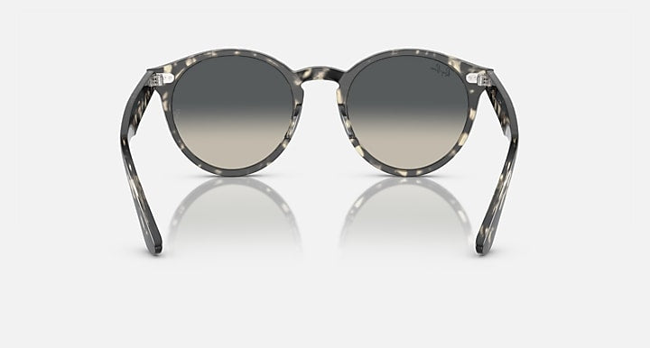 Black round sunglasses angled front with dark grey lenses and curved temples