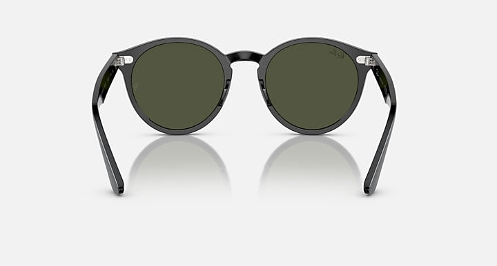 Ray-Ban round sunglasses with dark frames and olive-green lenses, front view