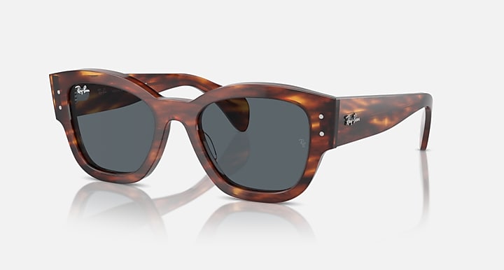 Havana tortoise sunglasses with dark grey lenses and curved plastic frame
