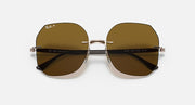 Ray-Ban RB8067 sunglasses with brown lenses and reflective dark stripe across lenses