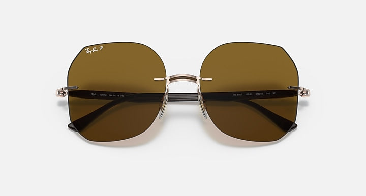 Ray-Ban RB8067 sunglasses with brown lenses and reflective dark stripe across lenses