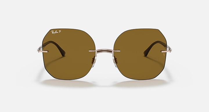 Sunglasses with round-rectangle brown lenses and silver metal bridge