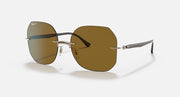 Sunglasses with brown mirrored lenses, silver metal frame, and curved temple arms