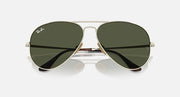 Ray-Ban aviator sunglasses with dark green tinted lenses and black temple arms, front view