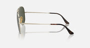Ray-Ban aviator sunglasses with dark green tinted lenses and black temple tips, side view