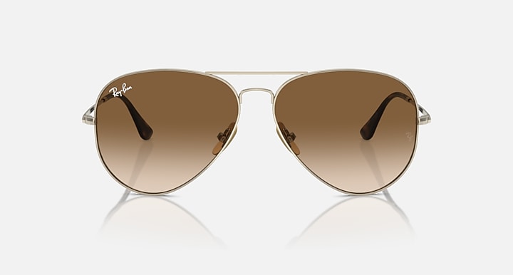 Ray-Ban aviator sunglasses with brown tinted lenses and gold frame, front view