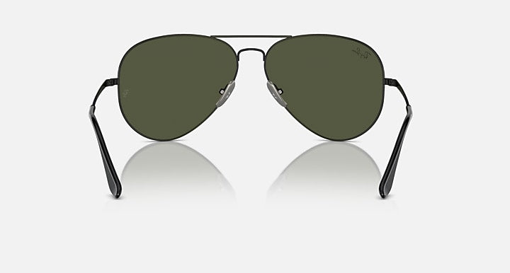 Aviator sunglasses with dark green lenses and matte black frame, low front view