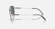 Silver metal sunglasses side view with dark gray lens and curved temple arms