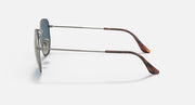 Ray-Ban sunglasses side view: gunmetal frame, dark blue mirrored lenses, brown temple tips