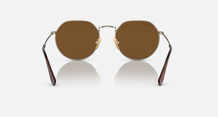 Round brown sunglasses with gold metal frame and mirrored brown lenses