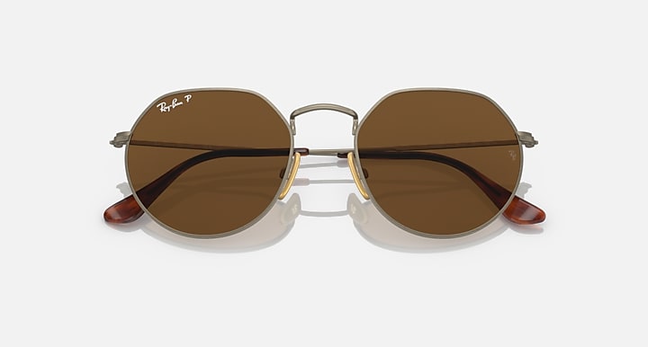 Round brown polarized sunglasses with gold frame and curved browline detail
