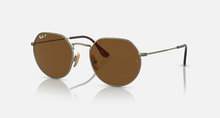 Round brown polarized sunglasses with antique gold metal frame and thin arms