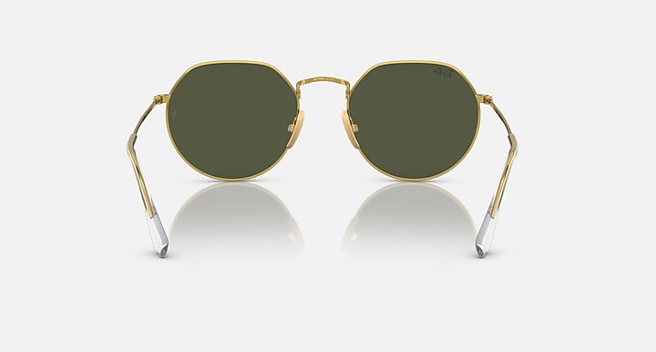 Round green sunglasses with gold metal frame and dark green lenses