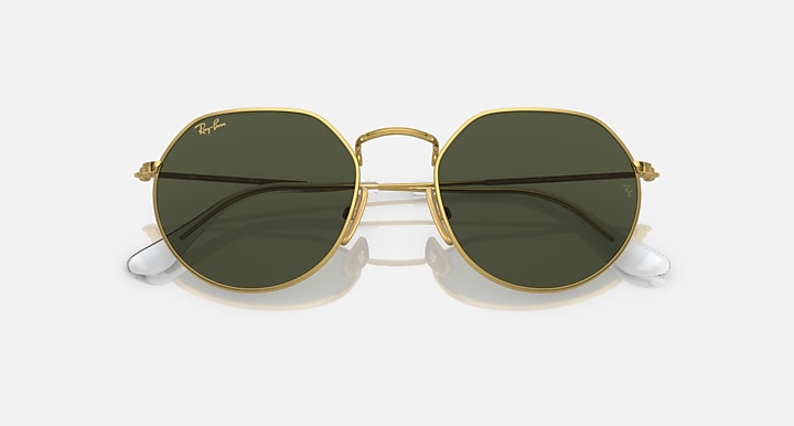 Round green polarized sunglasses with gold metal frame and reflective dark lenses