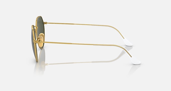 Round sunglasses side view with gold metal frame and green-tinted lens