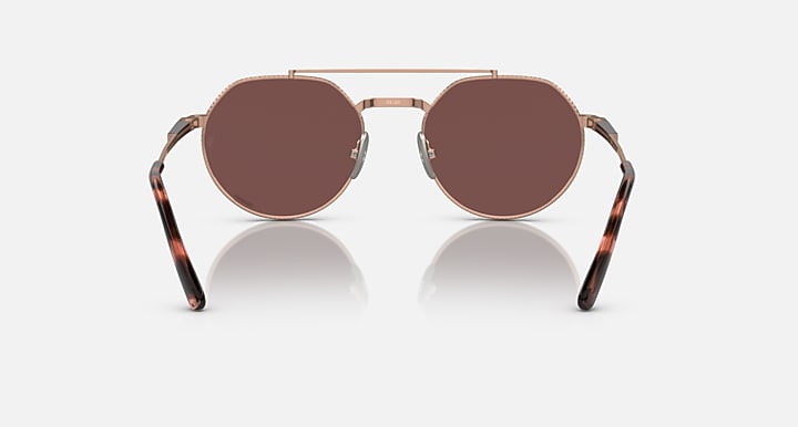 Ray-Ban Jack II round sunglasses with brown lenses, rose-gold frame, and tortoise arms.
