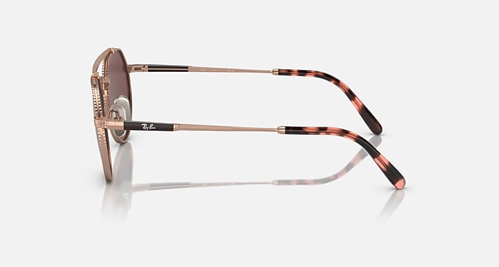Ray-Ban Jack II titanium sunglasses side view with brown lenses and rose-gold frame.