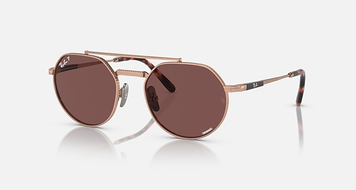 Ray-Ban Jack II round titanium sunglasses with brown lenses and rose-gold frame.