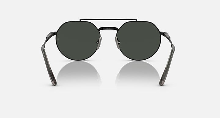 Ray-Ban Jack II round sunglasses with dark green lenses and black metal temples.