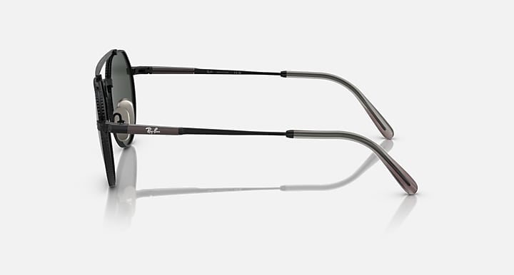 Ray-Ban Jack II titanium sunglasses side view with dark green lenses and black frame.