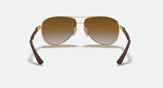 Ray-Ban aviator sunglasses with gold frame, brown gradient lenses, dark temples