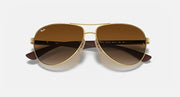 Ray-Ban aviator sunglasses with gold frame and dark brown gradient lenses