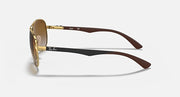 Ray-Ban aviator sunglasses, gold frame with brown carbon-fiber style temples