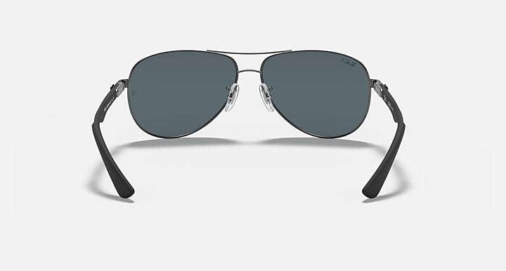 Ray-Ban aviator sunglasses with dark lenses and silver frame