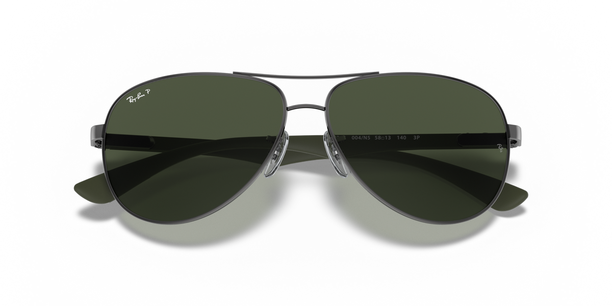 Ray-Ban aviator sunglasses with dark green lenses and metal frame, straight-on view