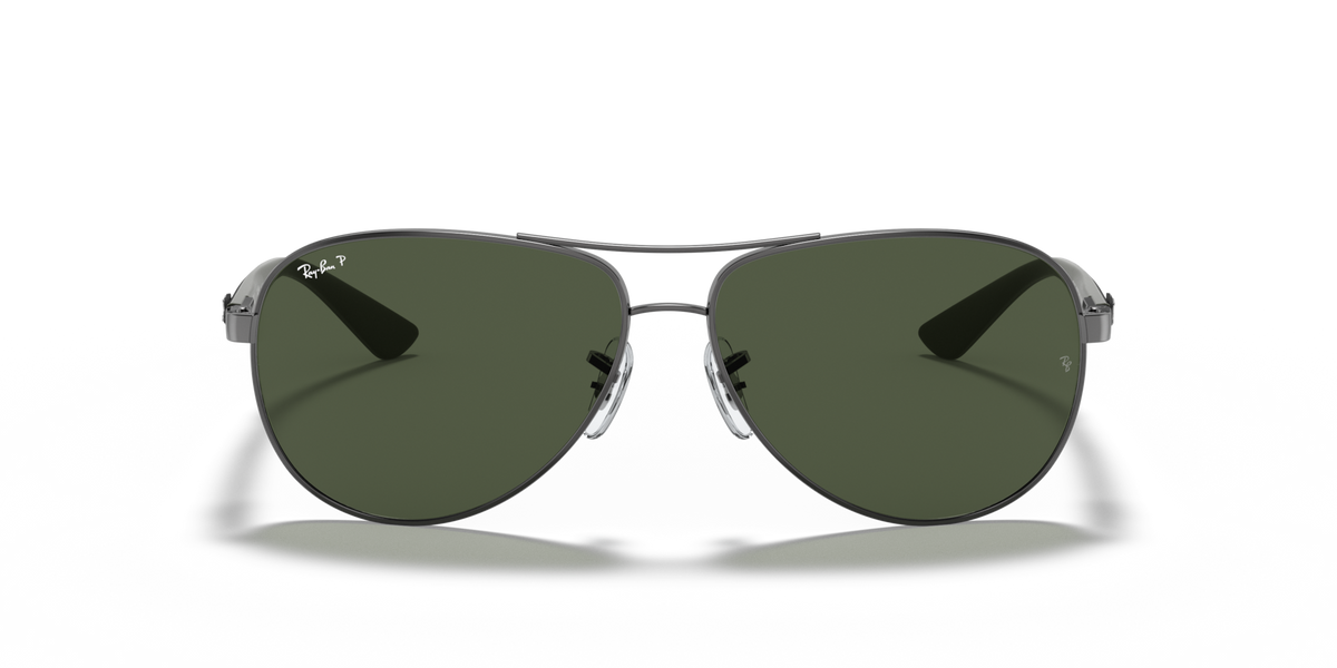 Ray-Ban aviator sunglasses with dark green lenses and metal frame, front view