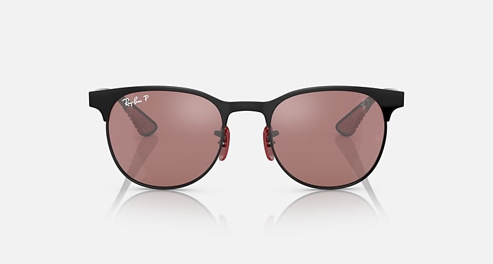 Ray-Ban sunglasses with rounded dark frame and rose-brown lenses