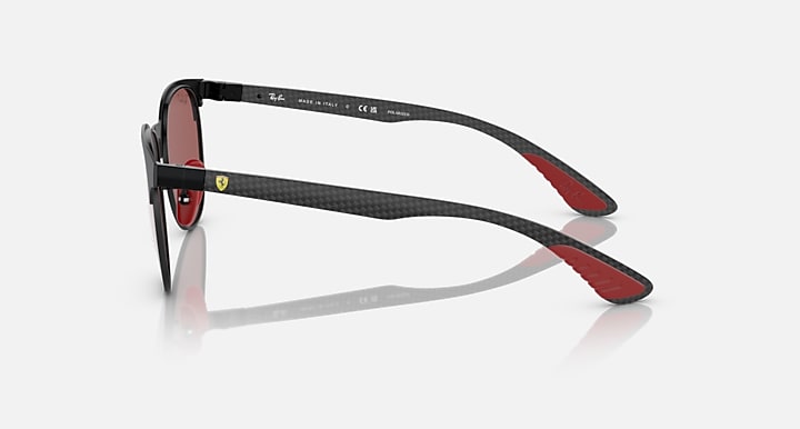 Ray-Ban sunglasses in dark frame with curved temple arms and rose-brown lenses