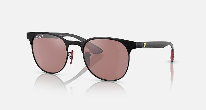 Ray-Ban sunglasses with dark frame and rose-brown tinted lenses